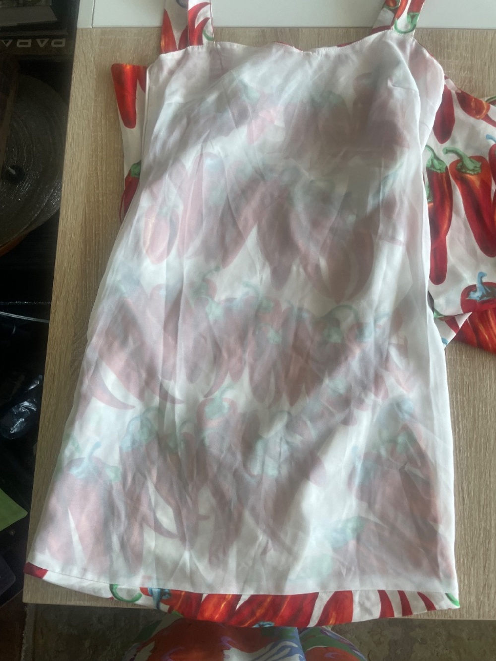 Red chili pepper print ruched mini dress featuring a side bow accent - Picture 8 of 10